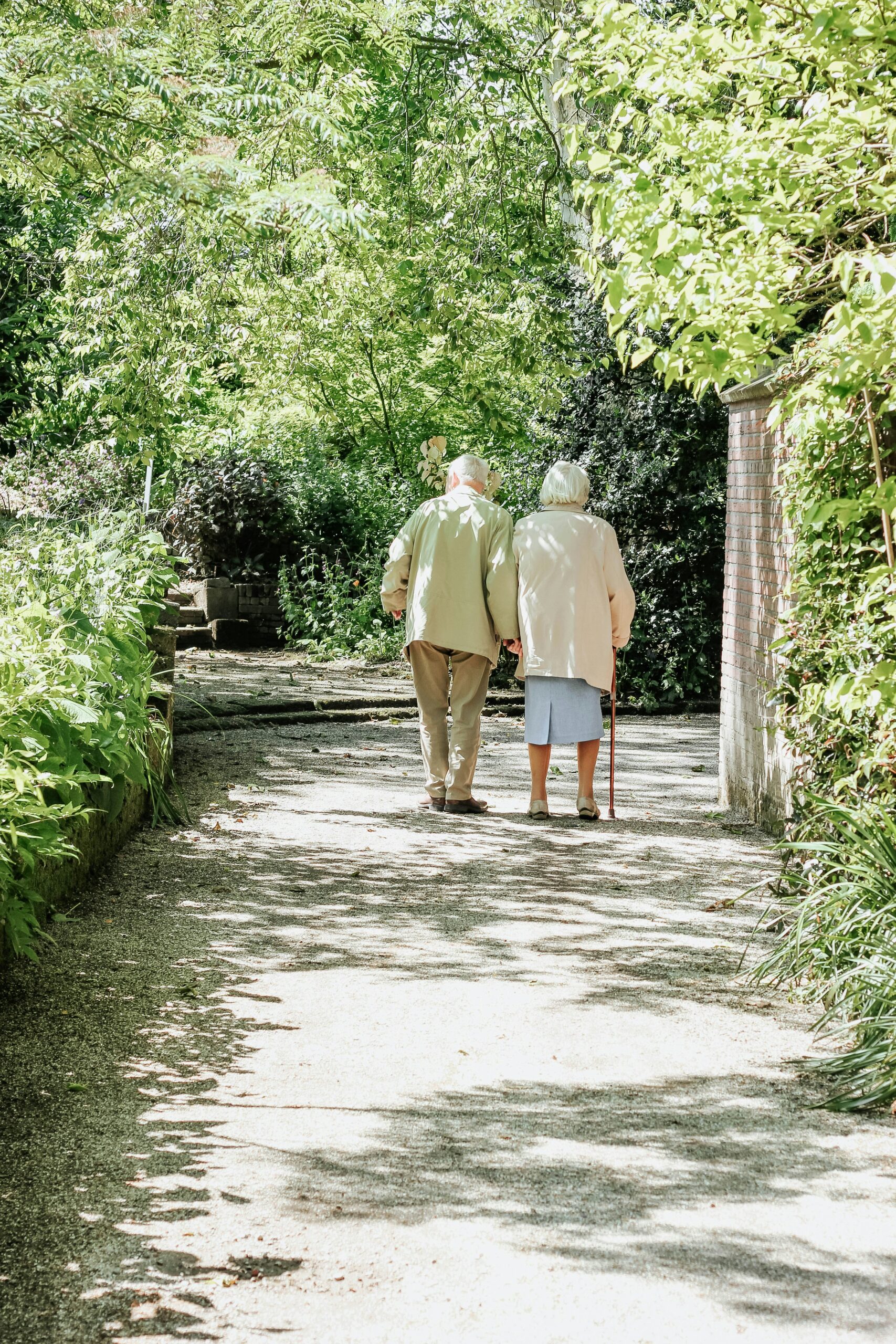 Couple walking together in a garden